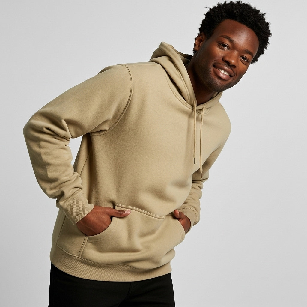 Australian male model in khaki hoodie with hands in pockets, confident casual stance, natural smile